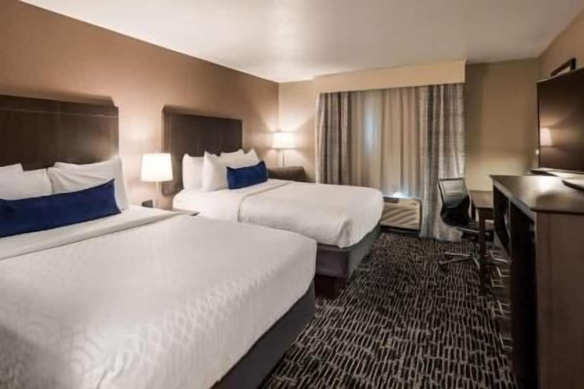 Premium bedding, pillow-top beds, desk, laptop workspace