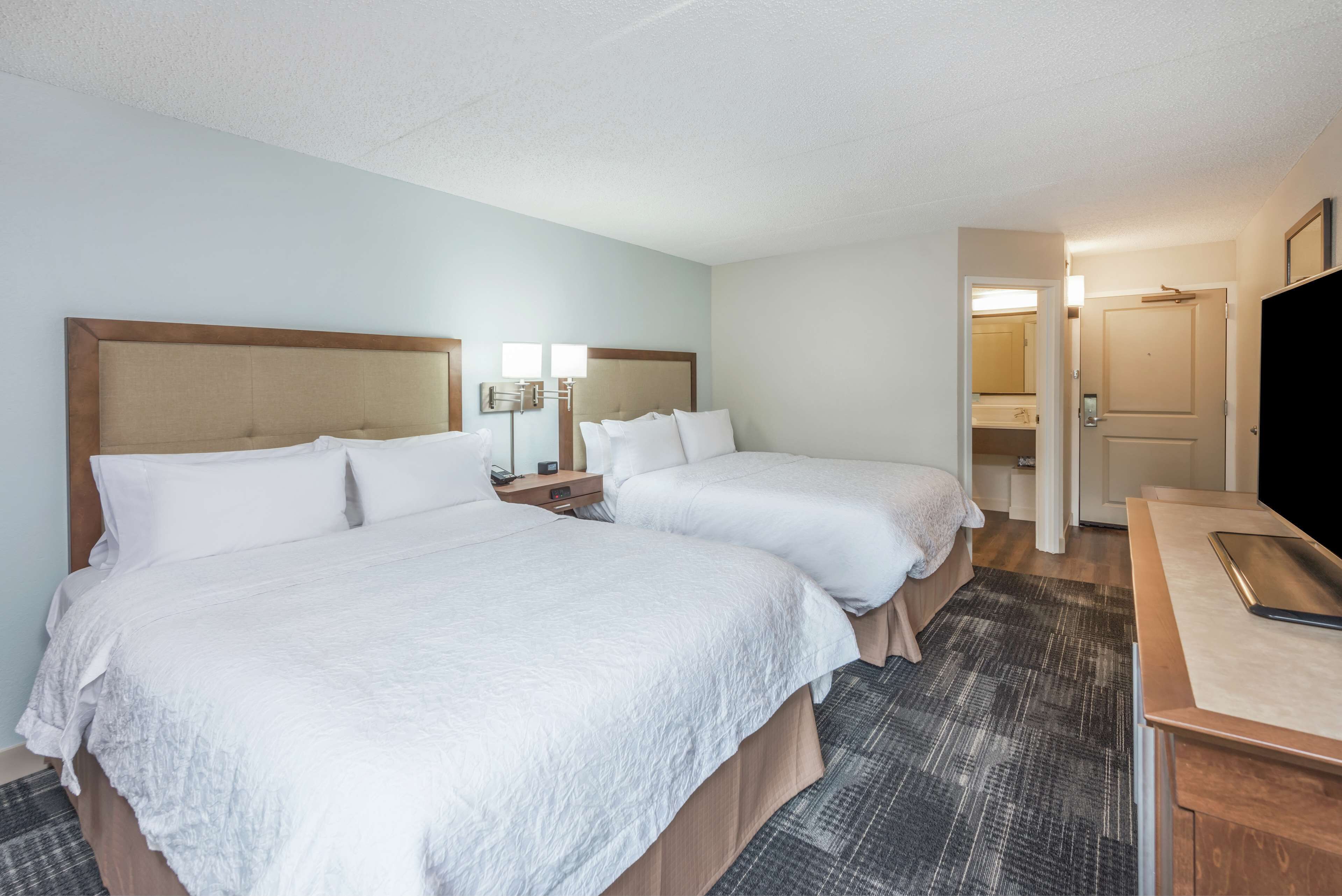 two queen size beds | in-room safe, iron/ironing board, cots/infant beds, free wifi