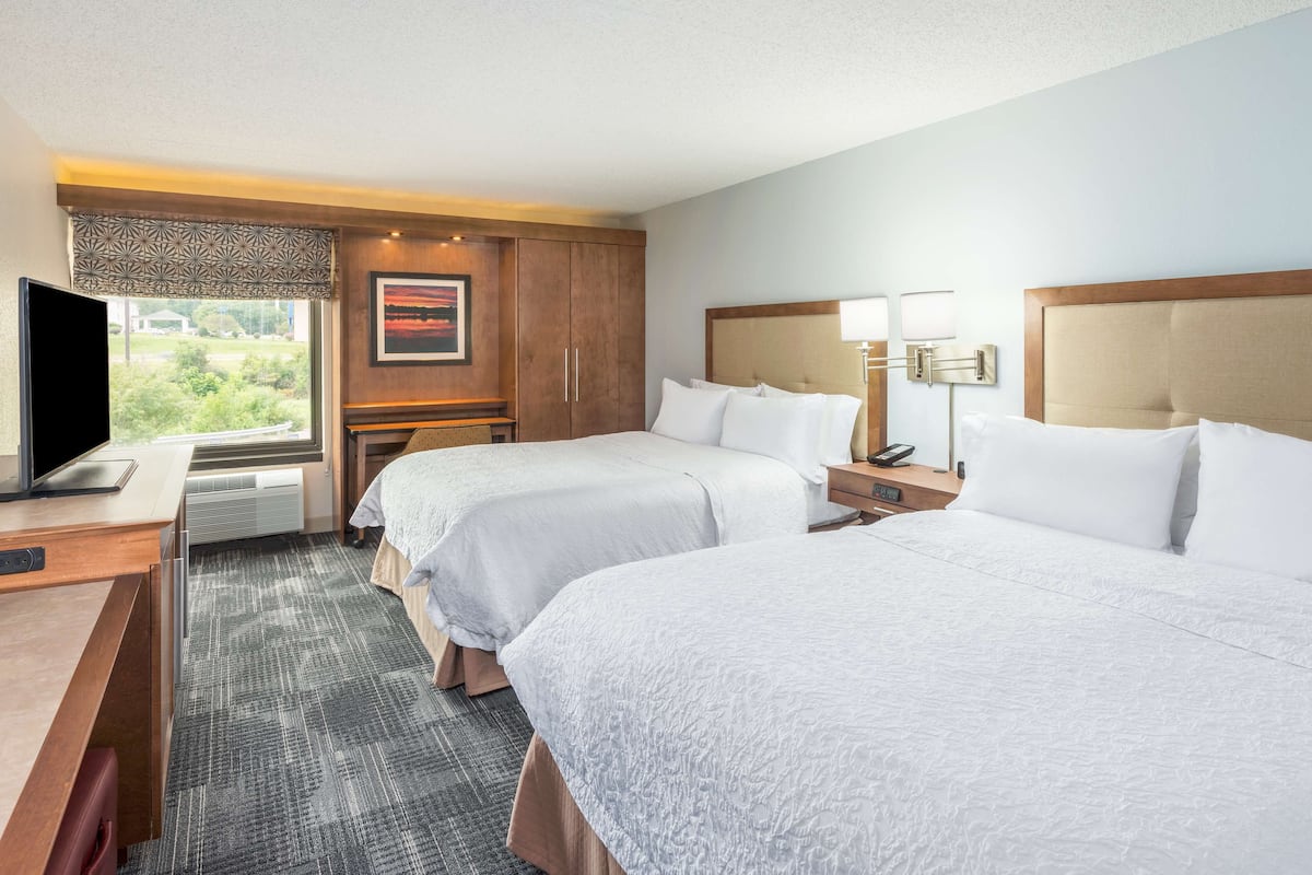 two queen size beds | in-room safe, iron/ironing board, cots/infant beds, free wifi