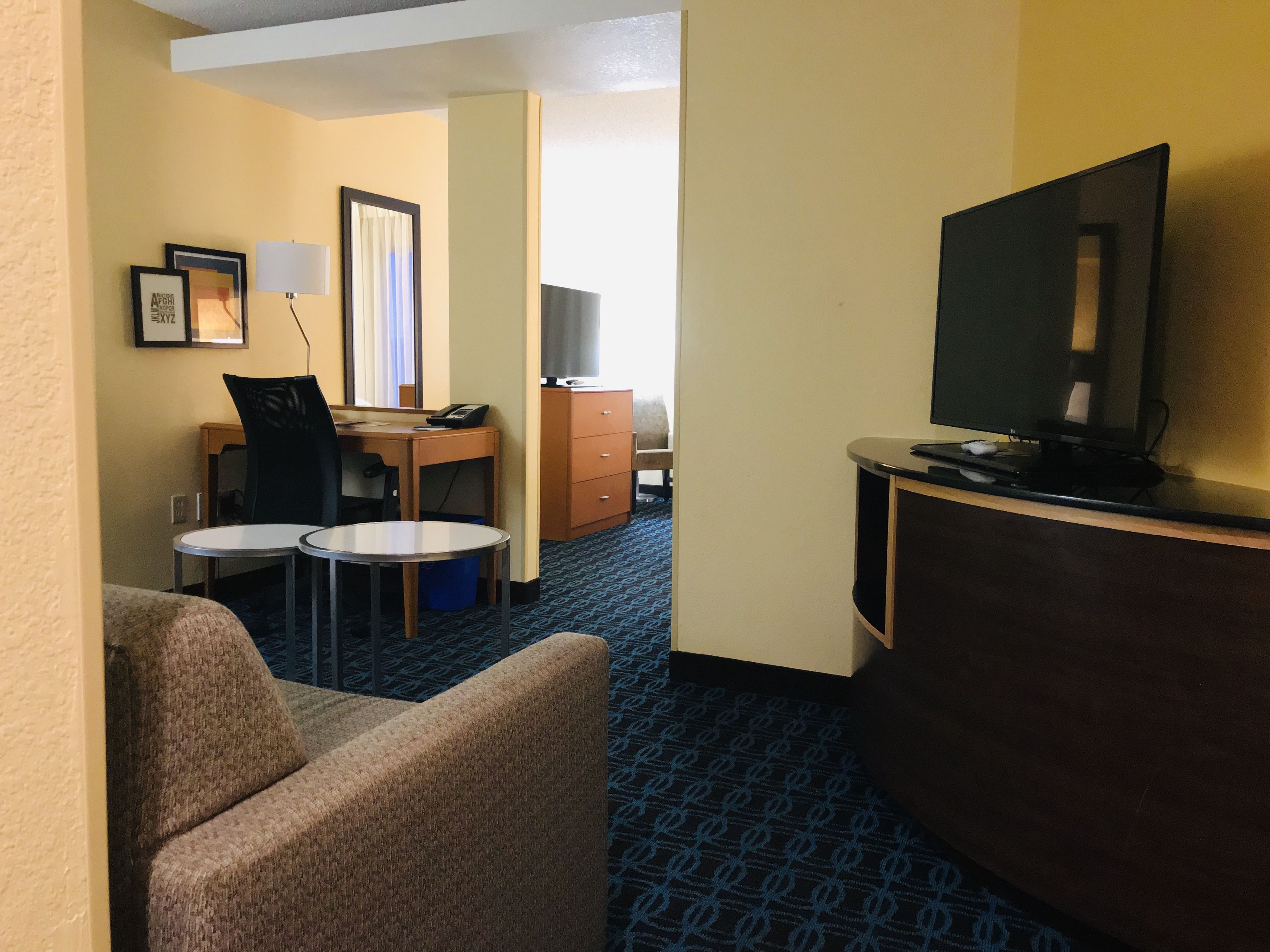 suite, 1 king bed with sofa bed, non smoking | living room | 34-inch flat-screen tv with cable channels, tv