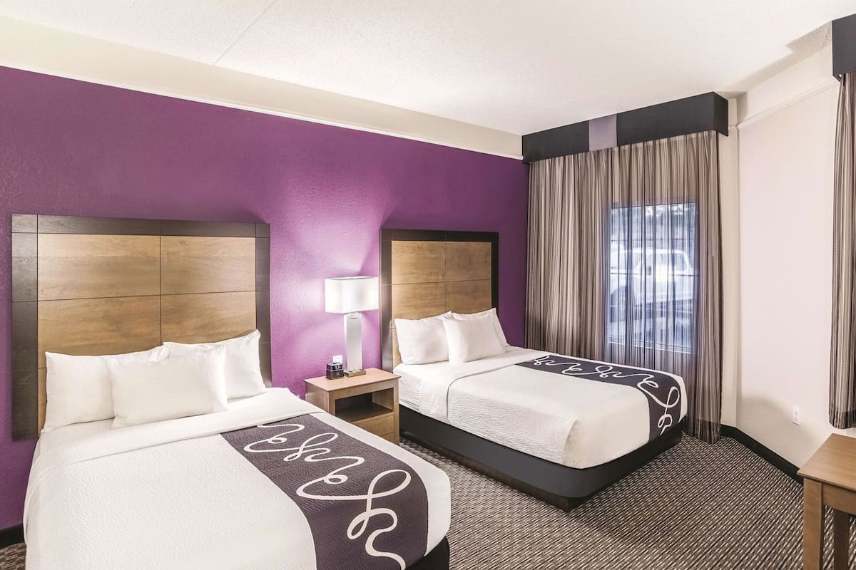Premium bedding, pillow-top beds, desk, blackout curtains