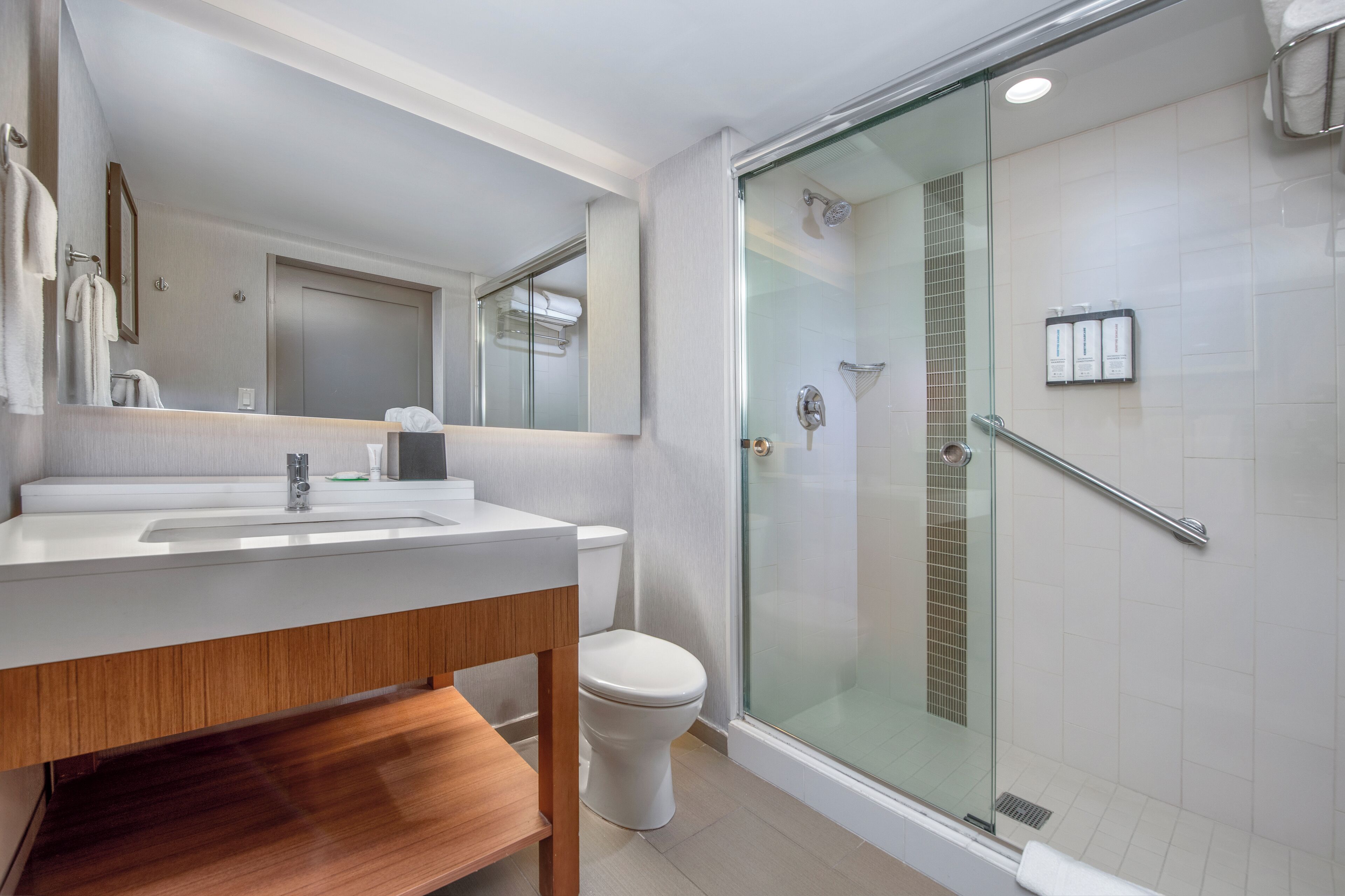 designer toiletries, hair dryer, towels