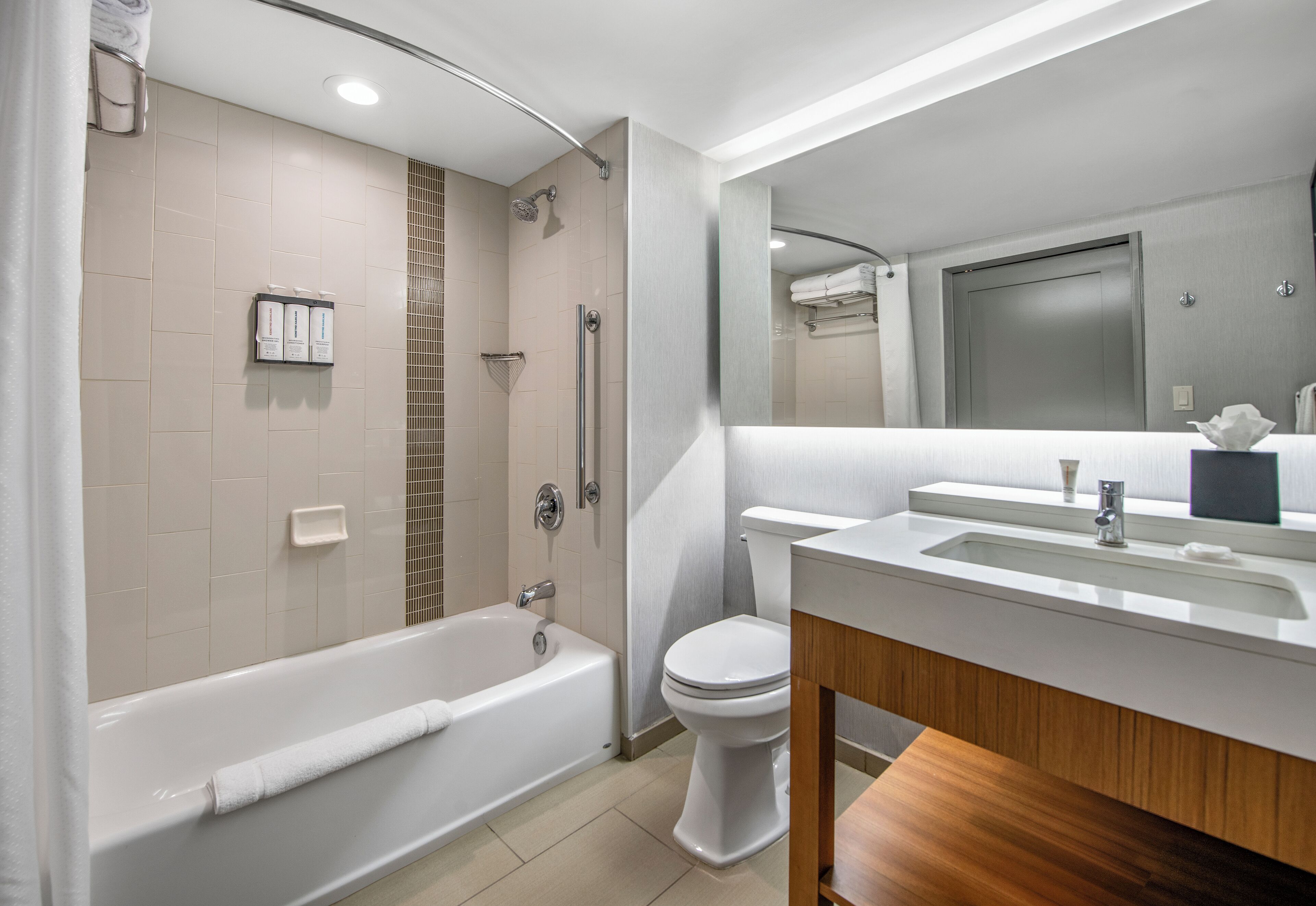 designer toiletries, hair dryer, towels