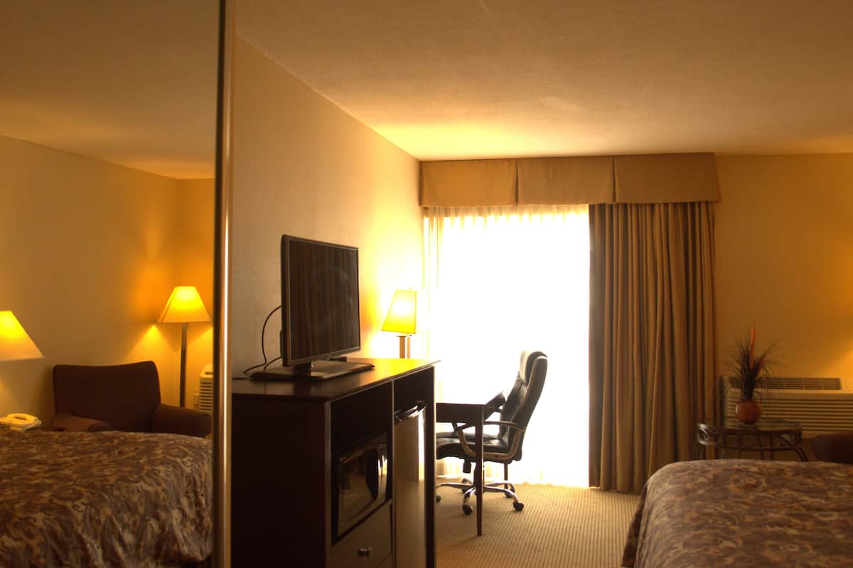 desk, blackout curtains, iron/ironing board, free cots/infant beds