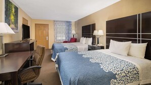 A hotel room with two beds, a desk, a chair, a TV, and a window with curtains. - Days Inn by Wyndham Thomaston (Thomaston)