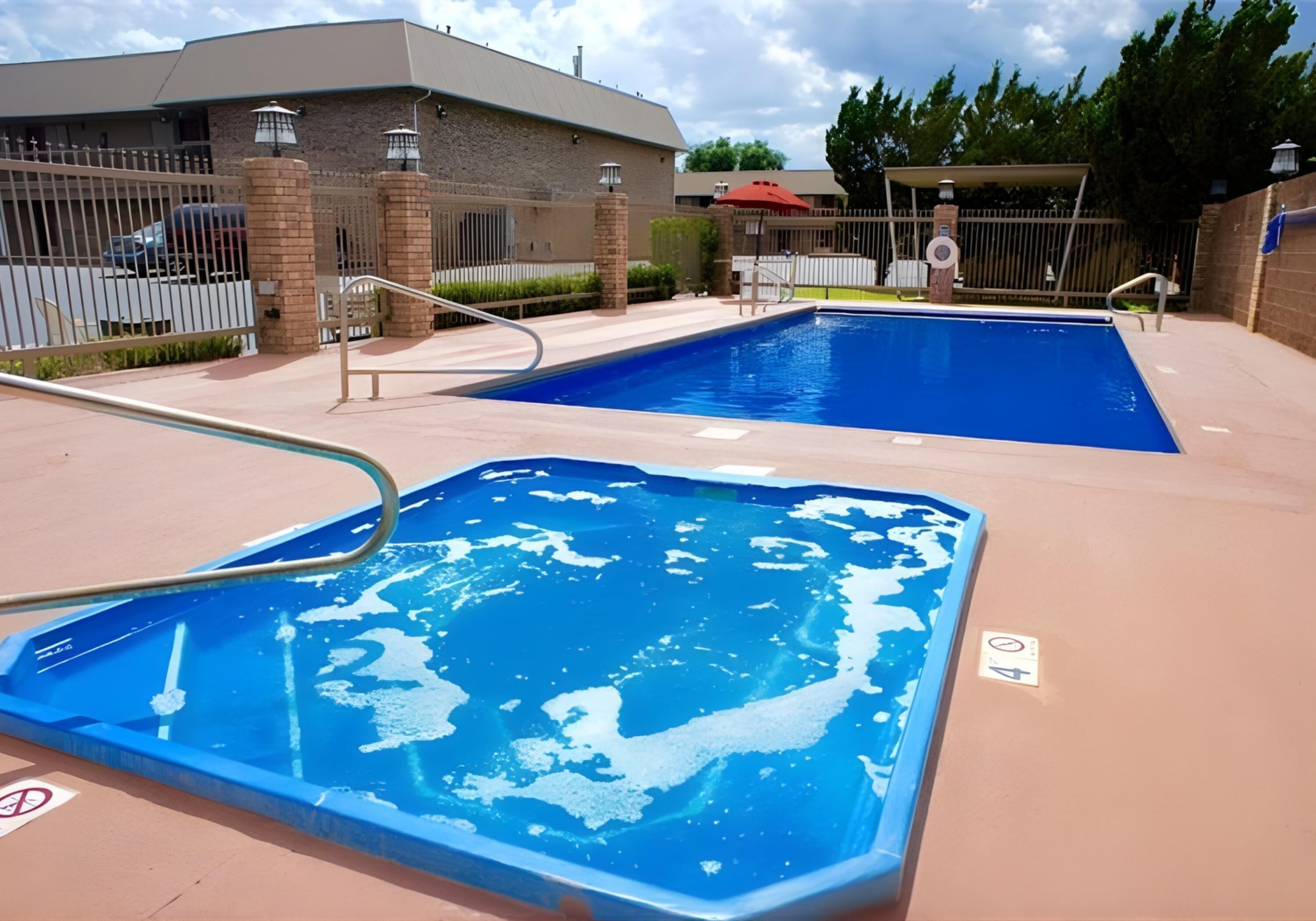 Outdoor pool, open 10:00 AM to 10:00 PM, pool loungers