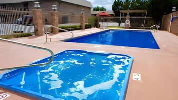 Outdoor pool, open 10:00 AM to 10:00 PM, pool loungers