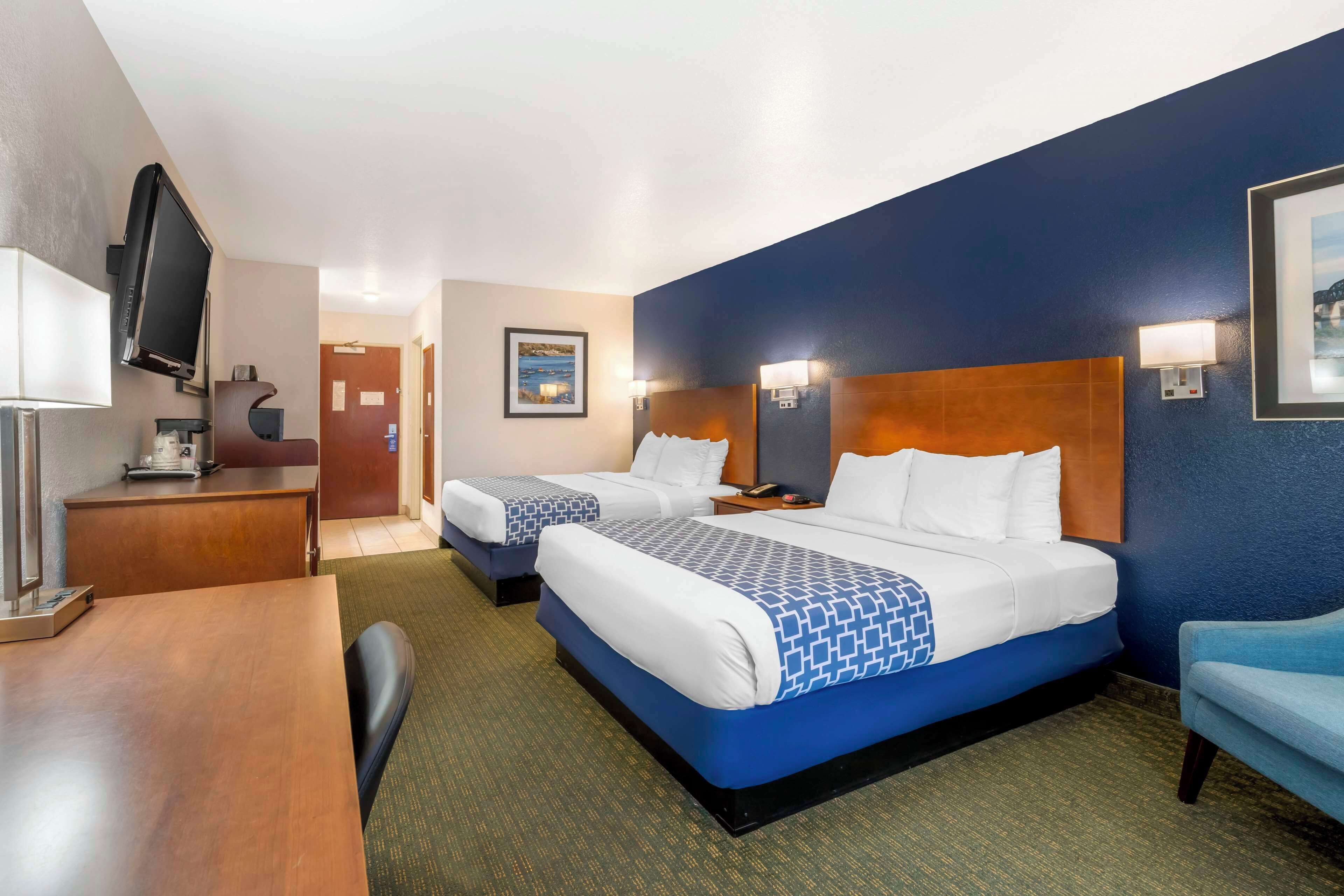 standard room, 2 queen beds, non smoking, refrigerator & microwave | desk, laptop workspace, iron/ironing board, free cots/infant beds