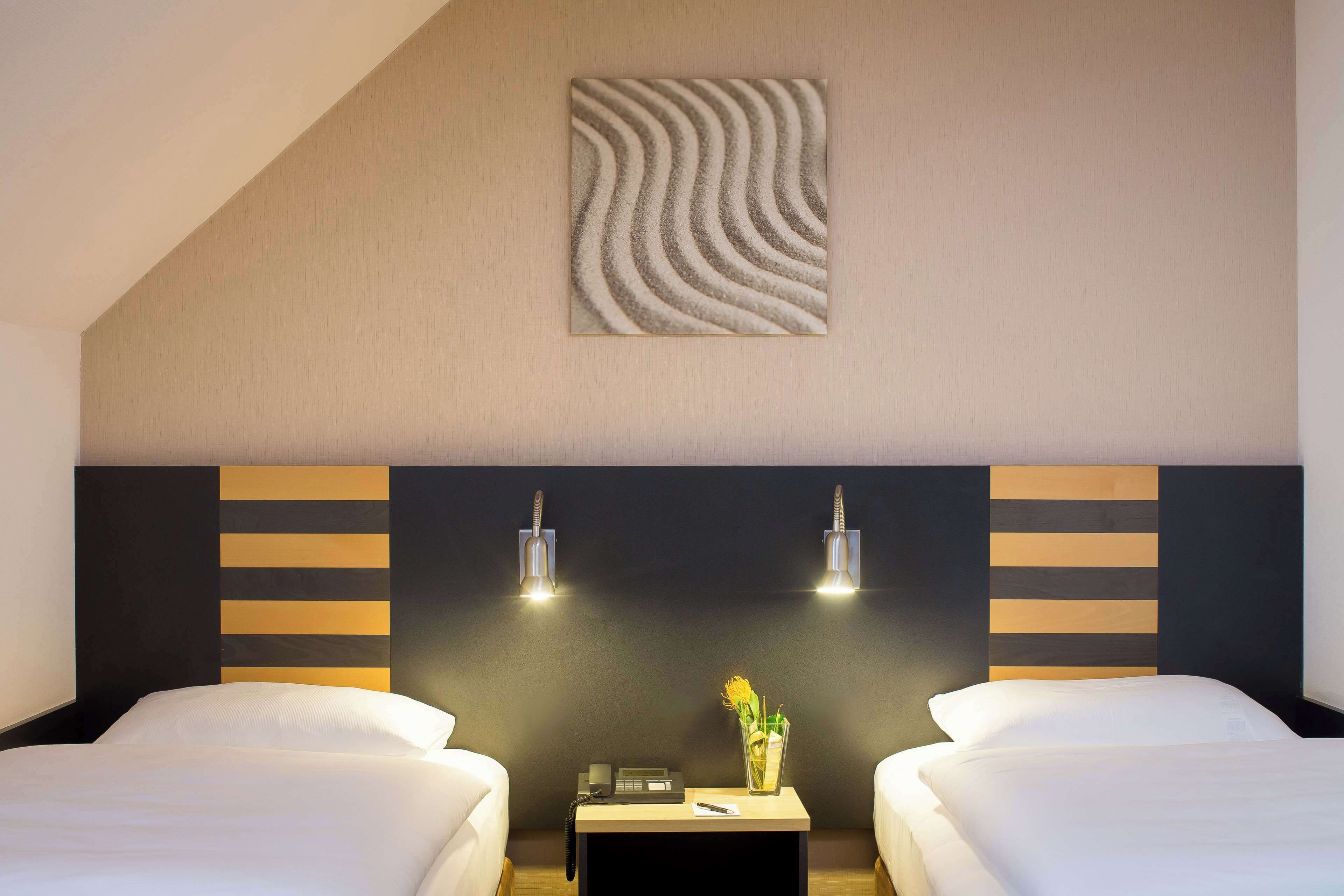 hypo-allergenic bedding, in-room safe, desk, blackout curtains