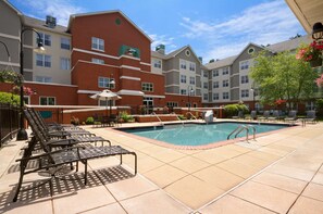 A hotel pool area with lounge chairs and a swimming pool. - Homewood Suites by Hilton Wilmington-Brandywine Valley (Wilmington)