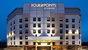 A multi-story hotel with a prominent 'Four Points by Sheraton' sign.