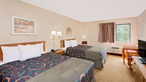 A hotel room with two beds, a desk, a chair, a TV, and a window with curtains. - Days Inn by Wyndham Boonville (Boonville)