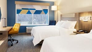 A hotel room with two beds, a desk, a chair, and a large window with a view of trees. - Holiday Inn Express Peachtree Corners - Norcross by IHG (Peachtree Corners)