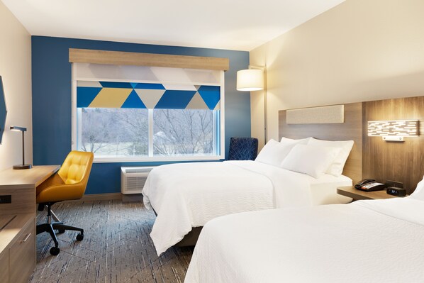A hotel room with two beds, a desk, a chair, and a large window with a view of trees. - Holiday Inn Express Peachtree Corners - Norcross by IHG (Peachtree Corners)