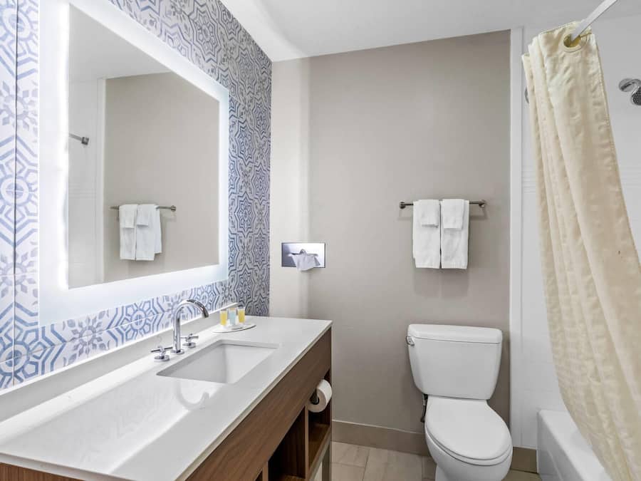 Standard Room, 2 Queen Beds | Bathroom | Combined shower/tub, free toiletries, towels