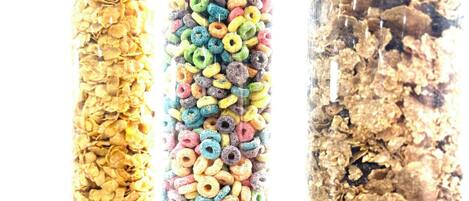 Three containers of different cereals.
