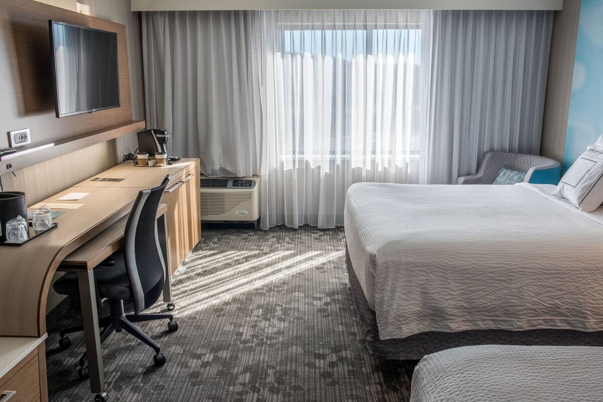 Hypo-allergenic bedding, laptop workspace, blackout curtains