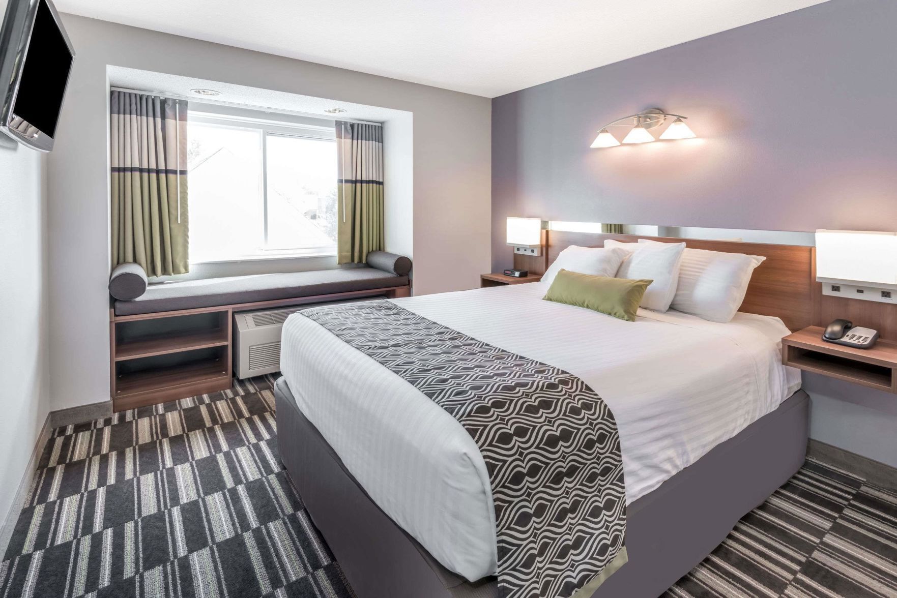 Premium bedding, pillow-top beds, desk, laptop workspace
