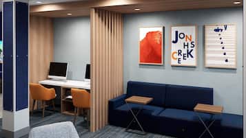 Relax in a calm and inviting space with a comfortable sofa, desk, and stylish seating area.