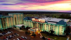A large hotel with a prominent 'Hollywood' sign, multiple floors, and a parking lot. - Hollywood Casino Tunica (Robinsonville)