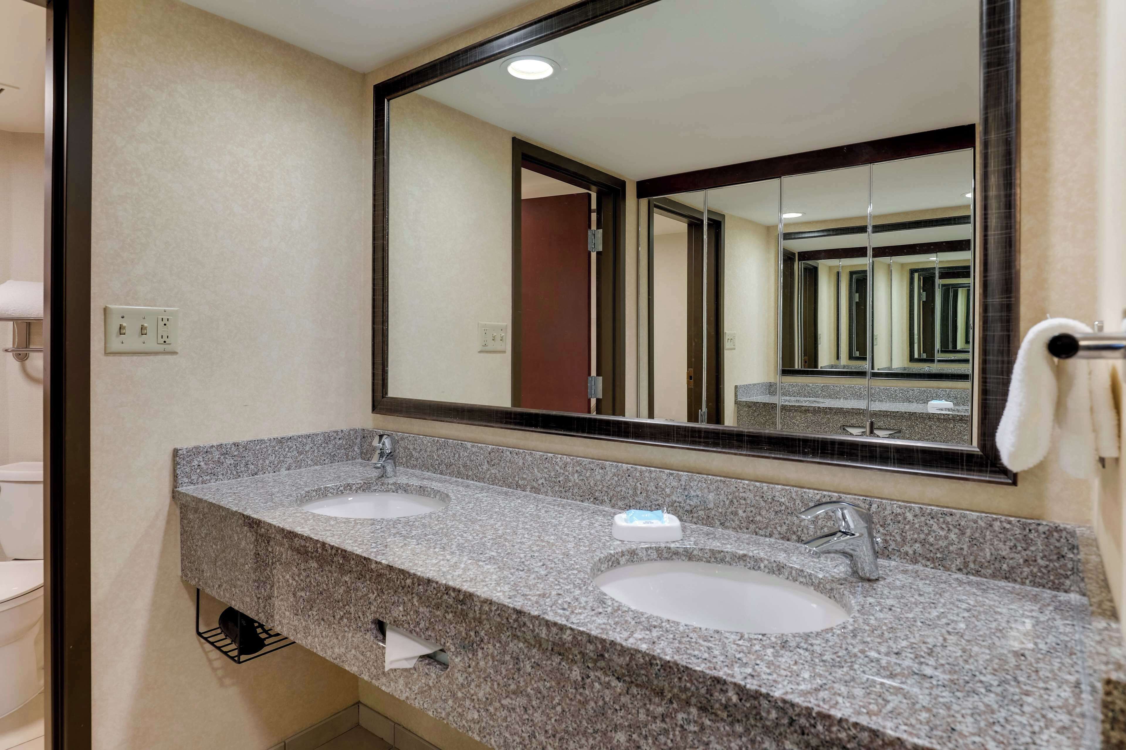 suite, 1 king bed, refrigerator & microwave (oversized room, upper floor) | bathroom | combined shower/bathtub, free toiletries, hair dryer, towels