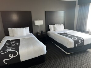 Premium bedding, desk, laptop workspace, blackout curtains