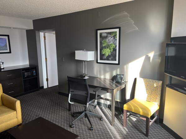 Premium bedding, desk, laptop workspace, blackout curtains