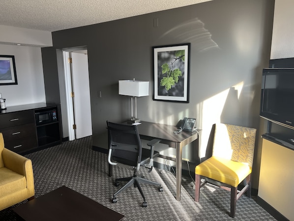 Premium bedding, desk, laptop workspace, blackout curtains