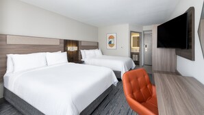 A hotel room with two beds, a TV, a desk, and a chair. - Holiday Inn Express Atlanta West - Theme Park Area by IHG (Lithia Springs)
