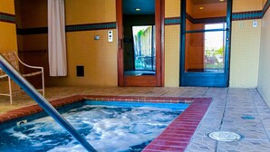A hot tub area with a view of the outside.
