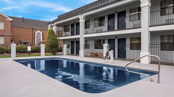 Seasonal outdoor pool, pool loungers