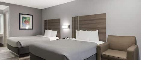 Premium bedding, desk, laptop workspace, blackout drapes