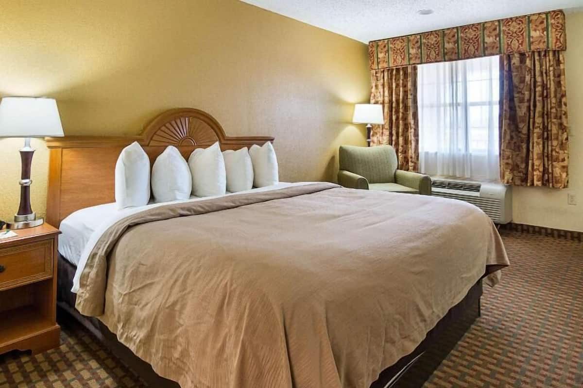 Premium bedding, desk, laptop workspace, blackout curtains