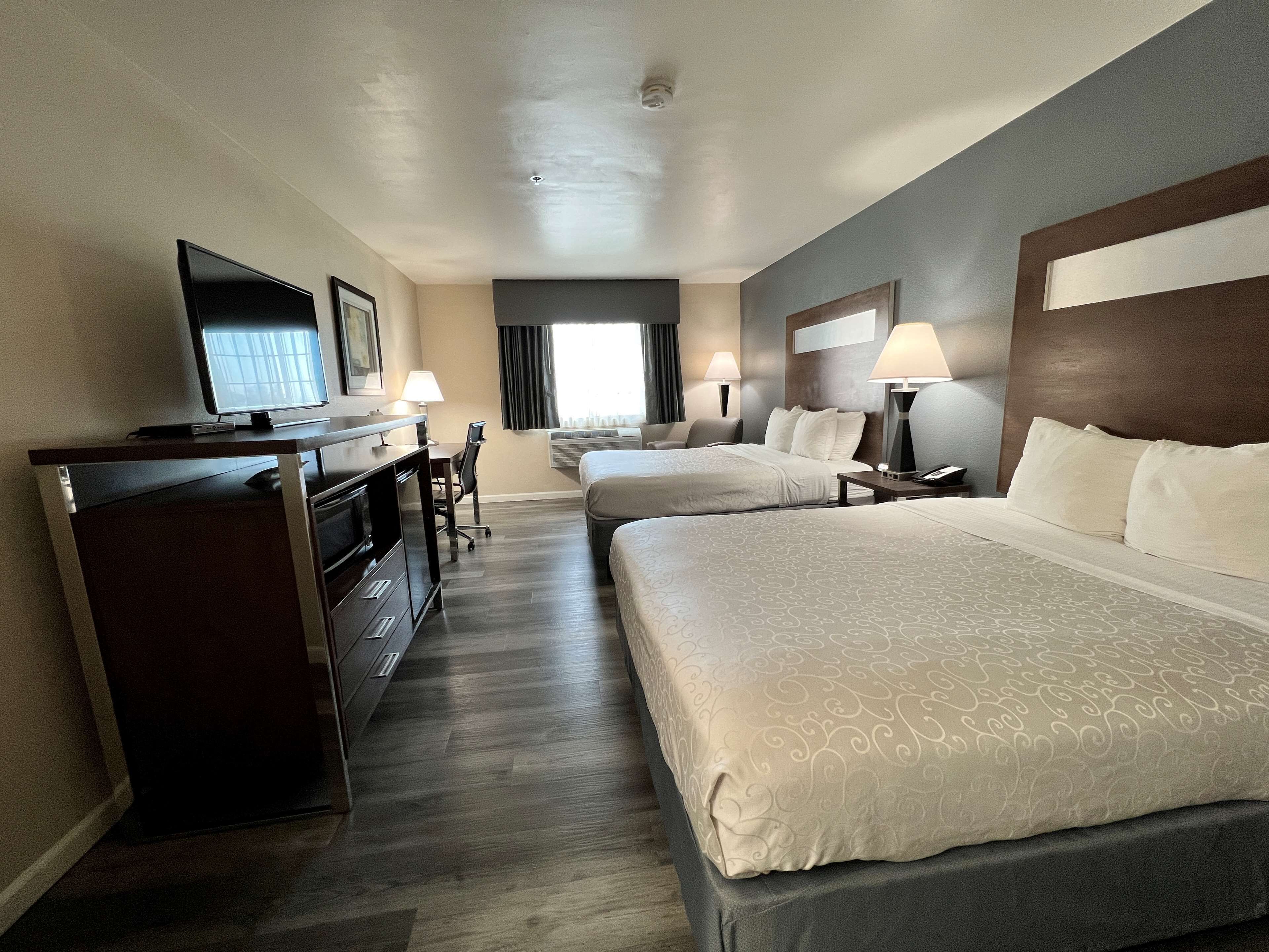 standard room, 2 queen beds, non smoking, refrigerator & microwave | down duvets, in-room safe, desk, iron/ironing board