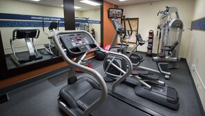 A gym with treadmills, elliptical machines, and weight equipment. - Hampton Inn Gainesville (Gainesville)