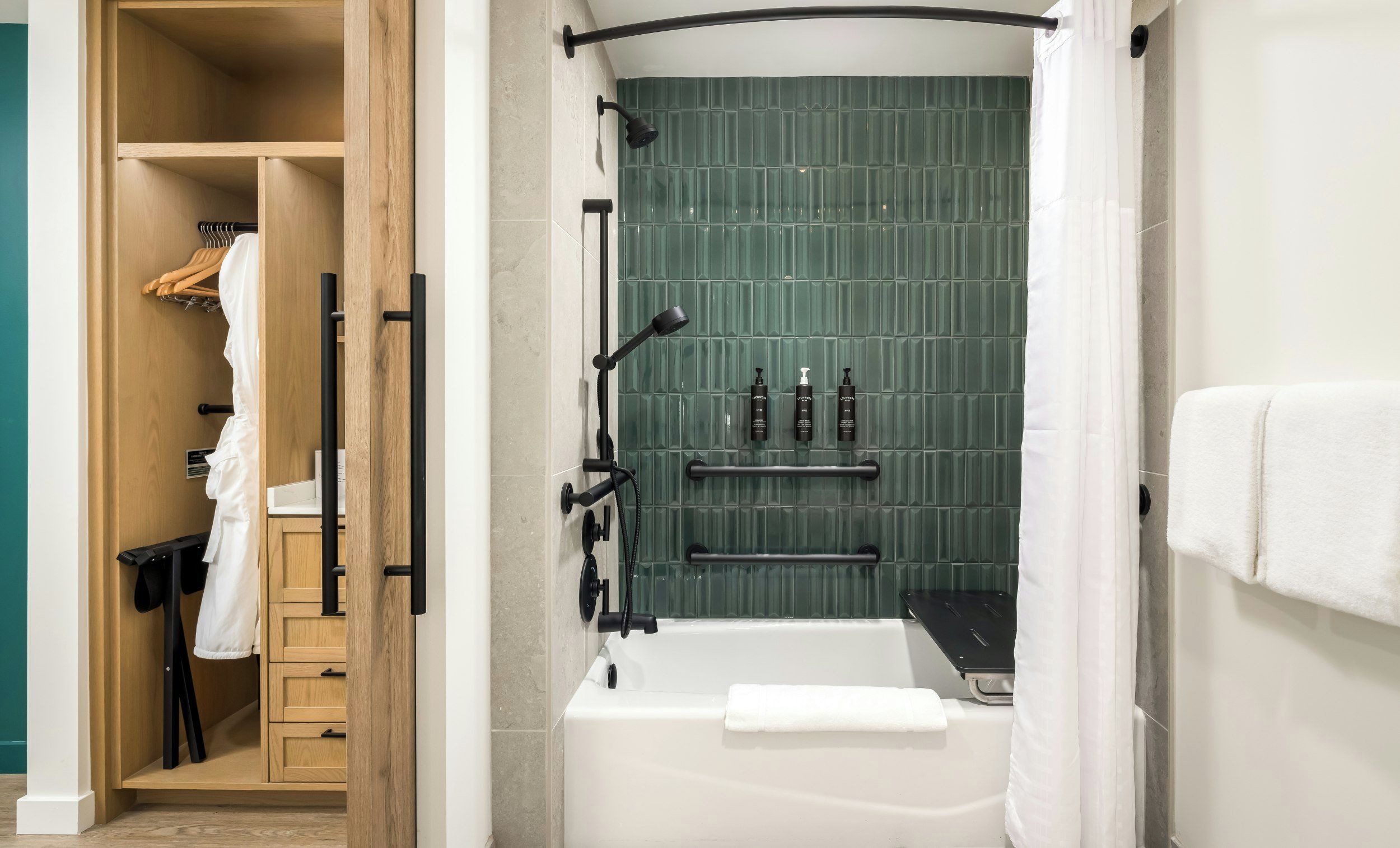 A modern bathroom with a bathtub, shower, and a wooden wardrobe.