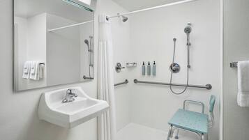 Room, 1 King Bed (Mobility/Hearing Access, Roll-In Shwr) | Bathroom | Combined shower/tub, free toiletries, hair dryer, towels