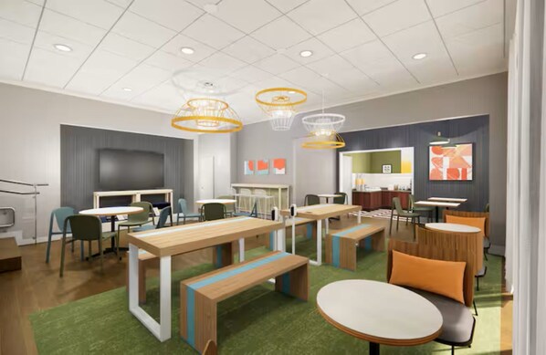 A modern office space with multiple desks, chairs, and a meeting area. - Spark by Hilton Fountain Hills Scottsdale (Fountain Hills)