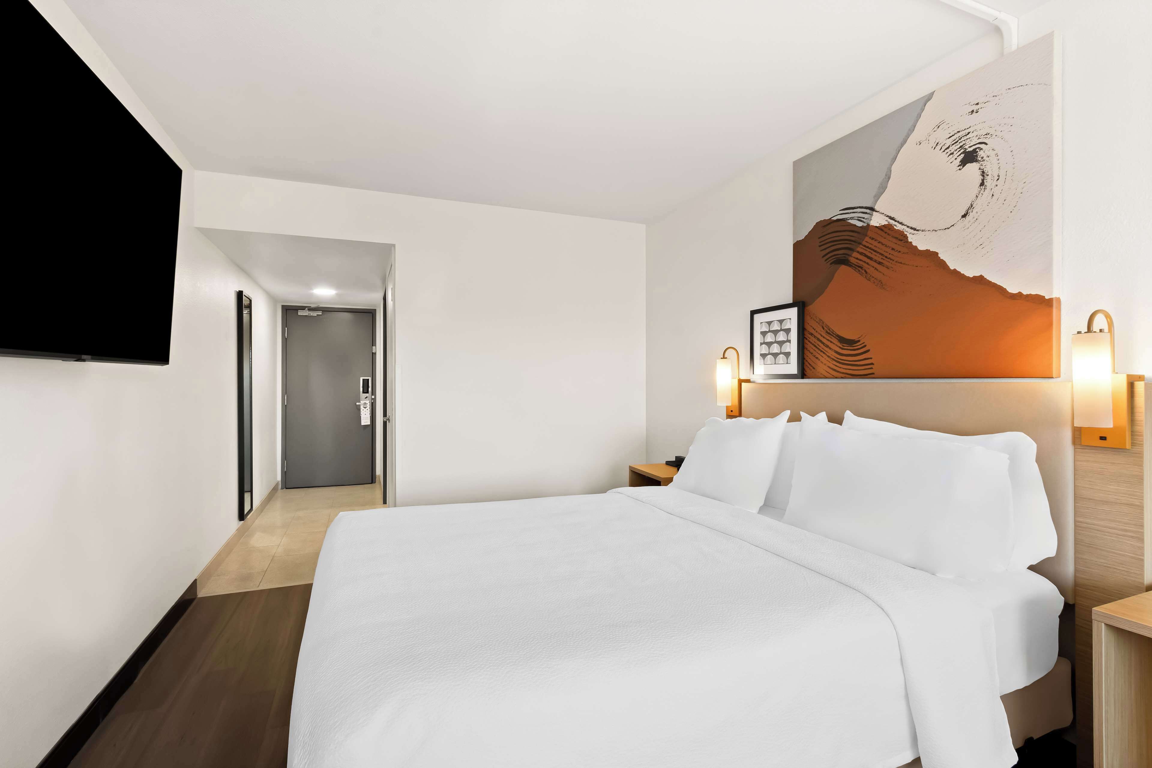 room, 1 queen bed | premium bedding, blackout curtains, iron/ironing board, free wifi