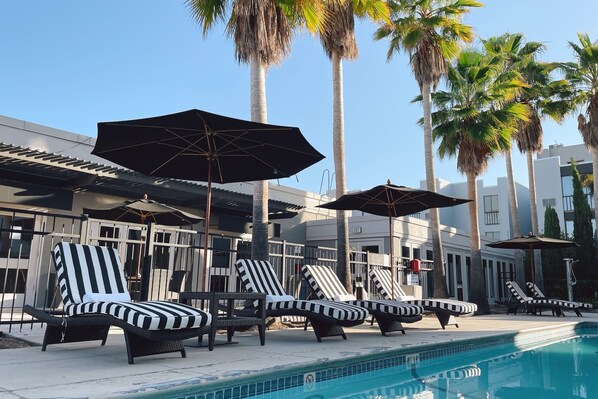 Outdoor pool, open 8:00 AM to 10:00 PM, pool umbrellas, pool loungers