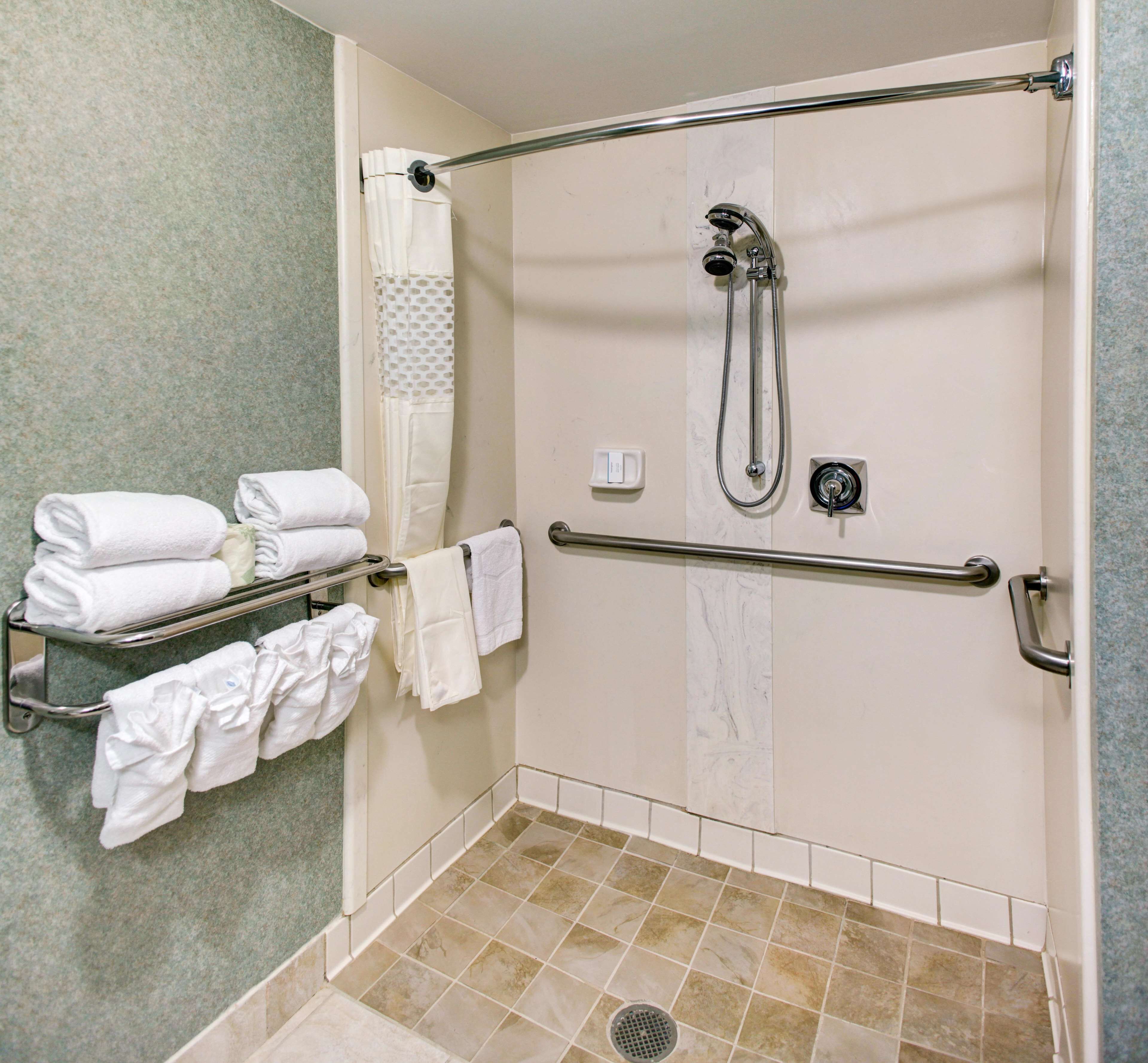 combined shower/bathtub, designer toiletries, hair dryer, bathrobes