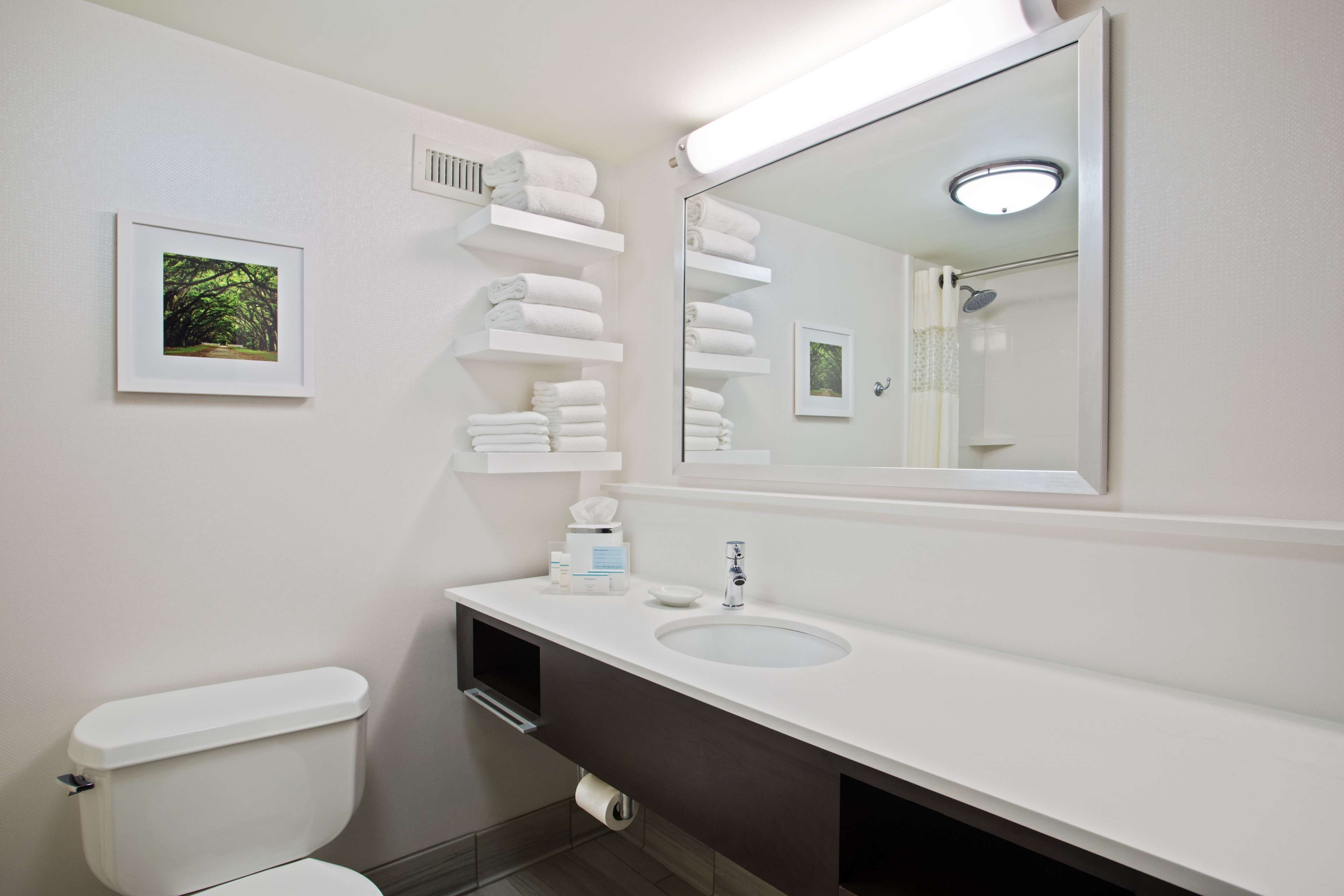 combined shower/bathtub, designer toiletries, hair dryer, bathrobes