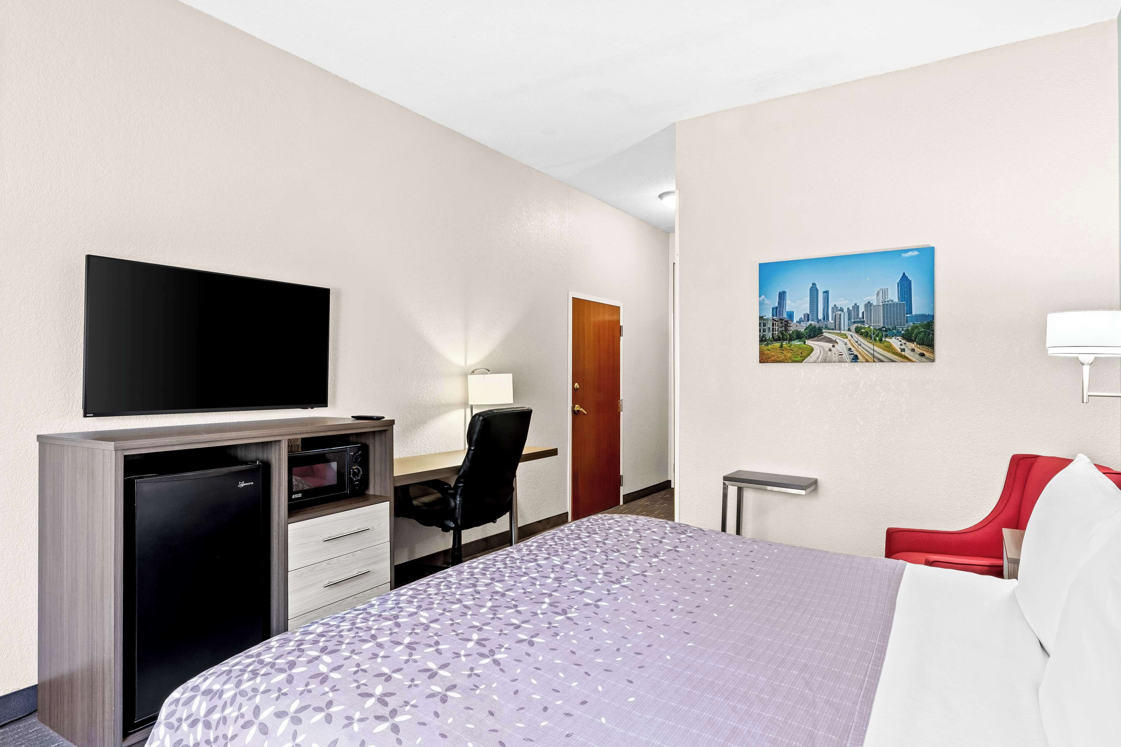 desk, laptop workspace, iron/ironing board, rollaway beds