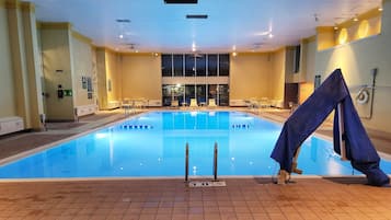 Indoor pool, open 6:00 AM to 11:00 PM, pool loungers