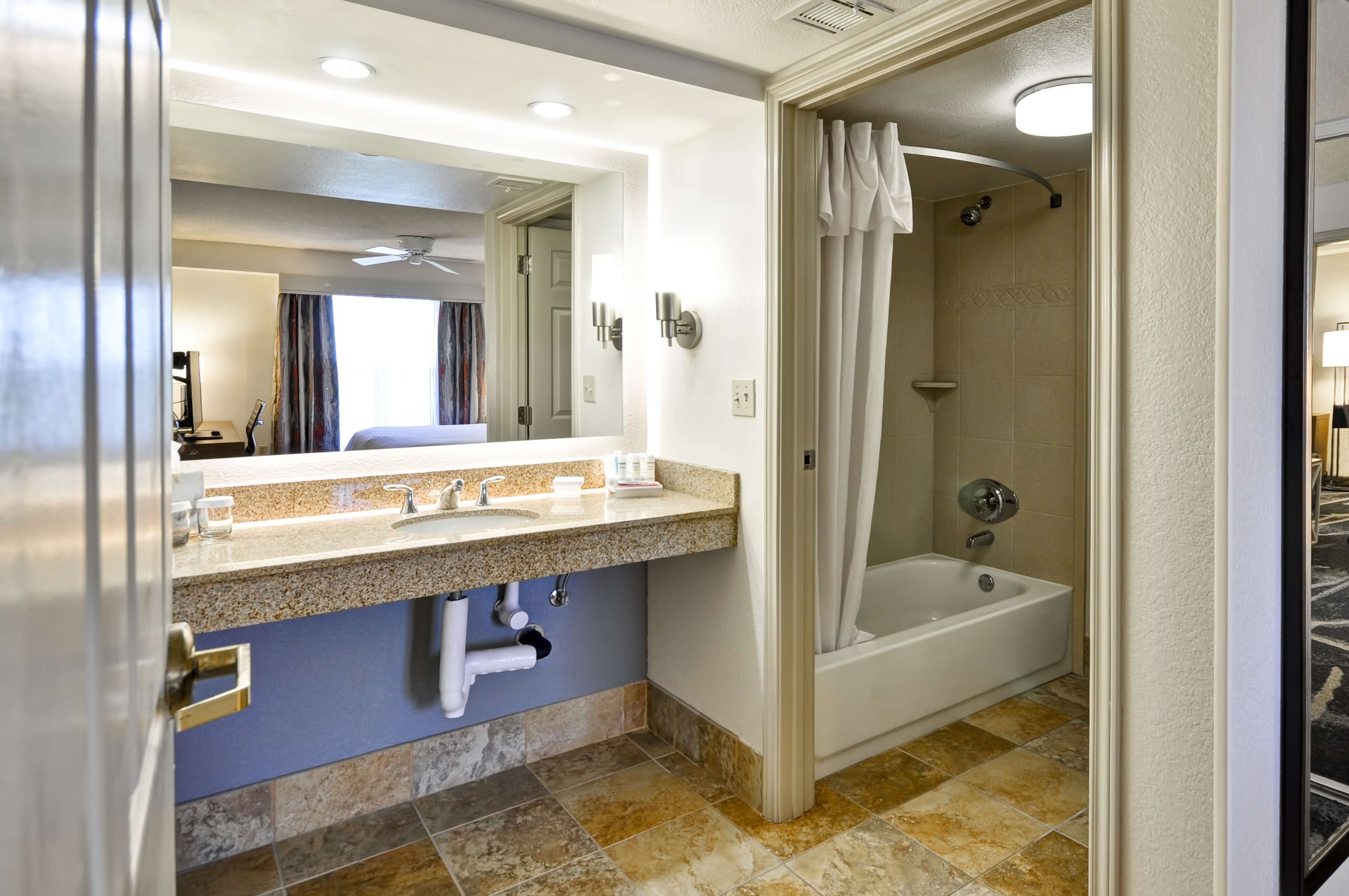 two bedroom suite, two doubles and one king bed, non-smoking | bathroom | free toiletries, hair dryer, towels, soap