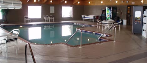 Indoor pool, open 6:00 AM to midnight, pool loungers