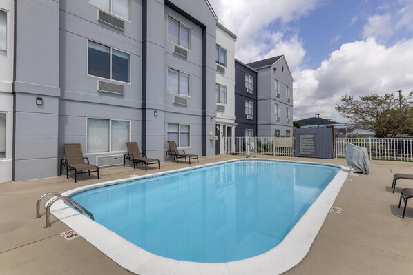 Outdoor pool, open 9:00 AM to 11:00 PM, sun loungers