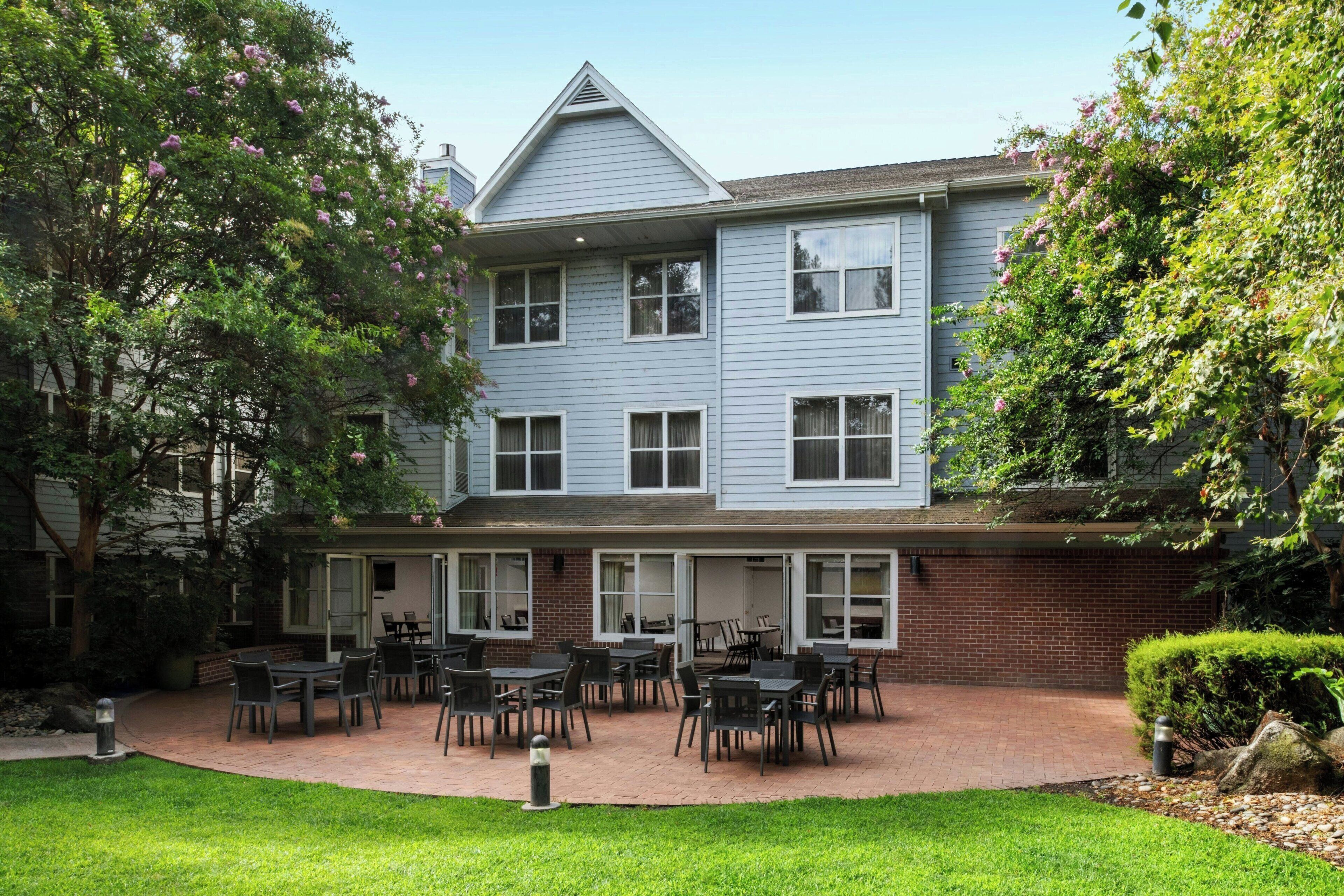 A two-story building with a brick facade and a flat roof.