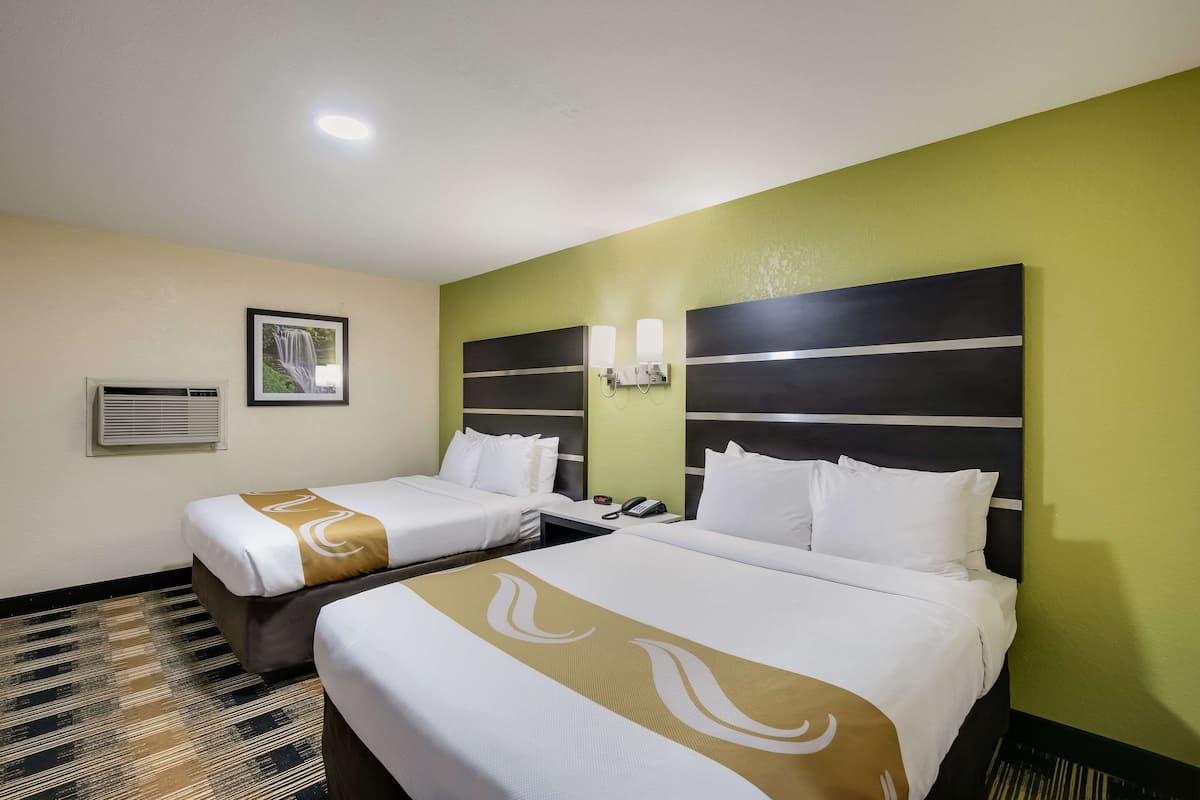 Suite, 2 Queen Beds, Non Smoking, Jetted Tub | Iron/ironing board, WiFi (free), bed sheets