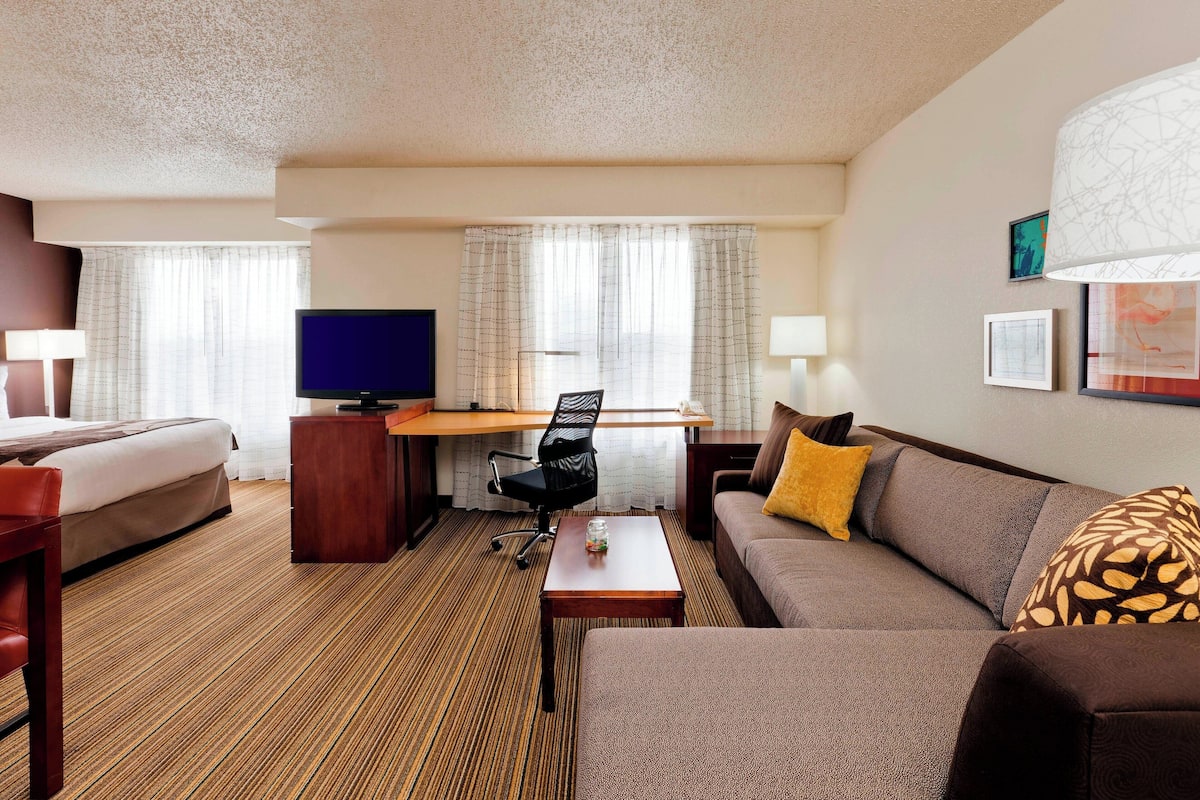 Premium bedding, desk, laptop workspace, blackout curtains